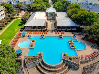 Resort style pool with lounge chairs